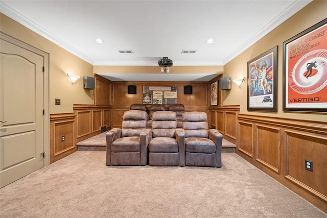 carpeted home theater room with ornamental molding