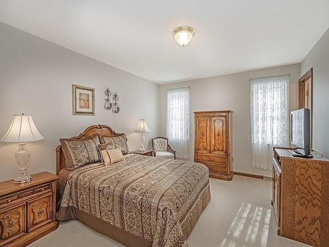 bedroom with light colored carpet