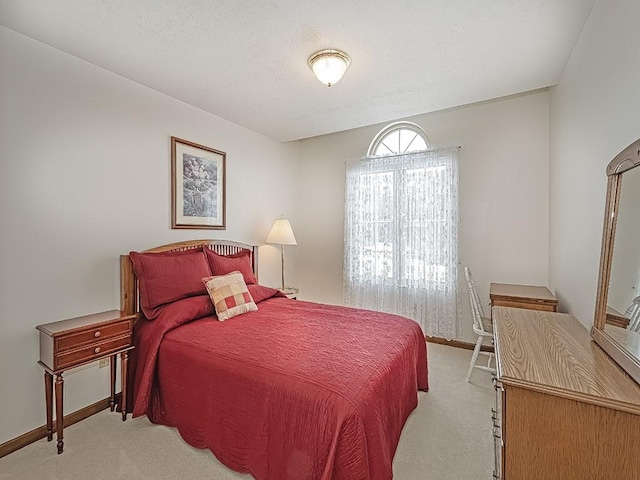 bedroom with light carpet