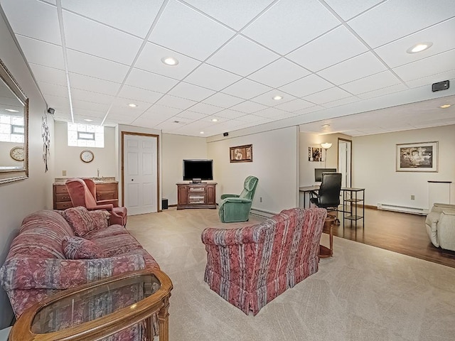 living room featuring a baseboard radiator and light carpet