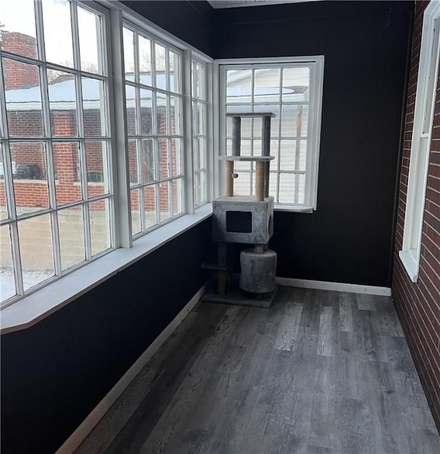 unfurnished sunroom featuring a wealth of natural light