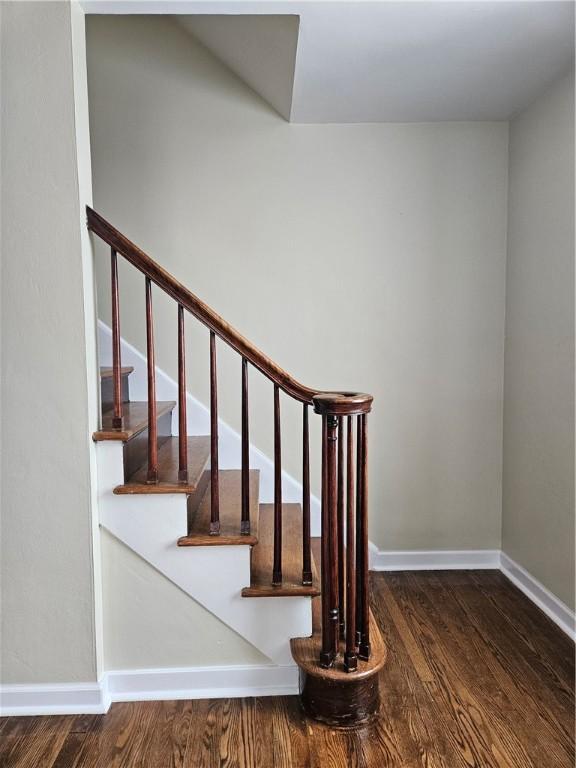 staircase featuring hardwood / wood-style floors