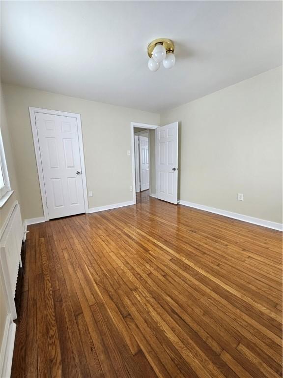 1732 Pennsylvania Ave, West Mifflin, PA 15122 - unfurnished bedroom with wood-type flooring and baseboards
