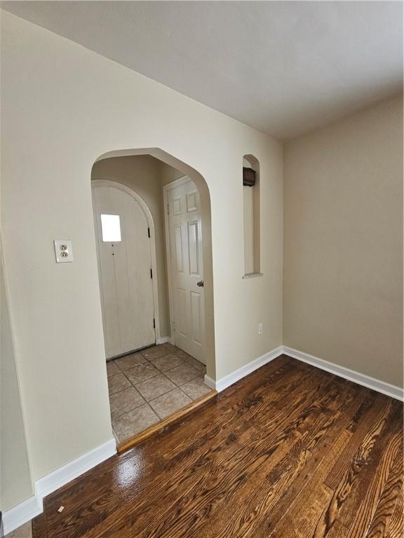 entryway with wood-type flooring