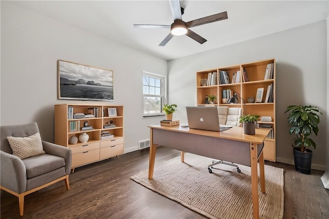 office space with dark wood-type flooring and ceiling fan