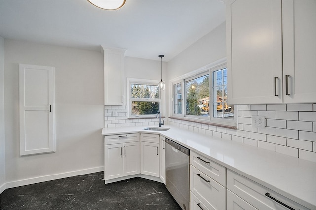 kitchen with white cabinetry, sink, pendant lighting, and dishwasher