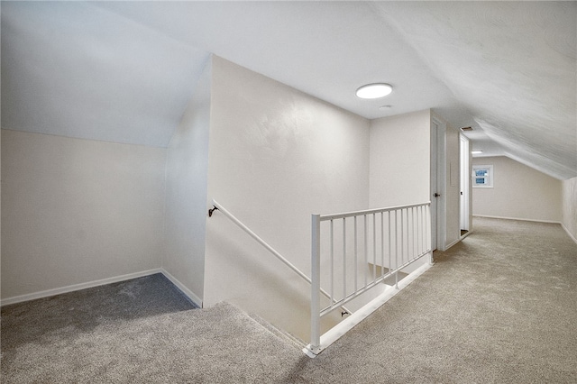 bonus room featuring lofted ceiling and carpet