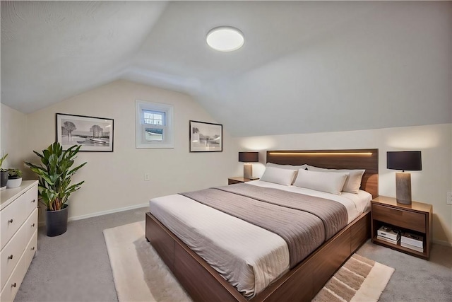 carpeted bedroom featuring vaulted ceiling