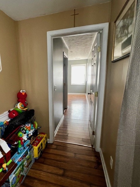 corridor with dark wood-type flooring