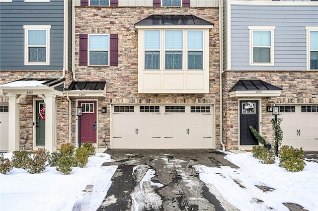 multi unit property featuring a garage