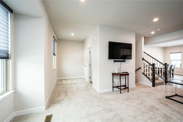 living room with light colored carpet