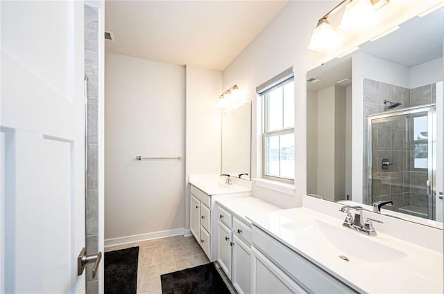 bathroom featuring vanity, an enclosed shower, and tile patterned flooring