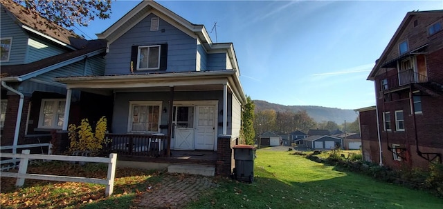 view of front facade with a porch and a front yard