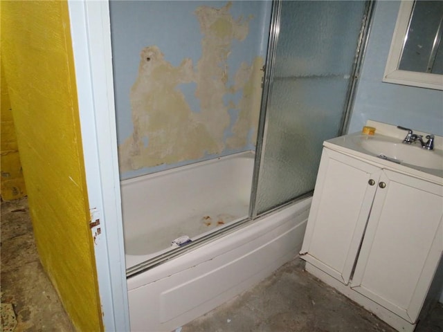 bathroom with vanity, bath / shower combo with glass door, and concrete floors