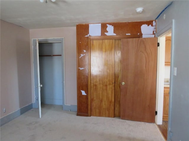 carpeted bedroom with a closet