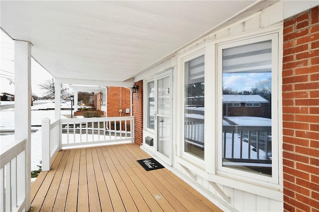 view of snow covered deck