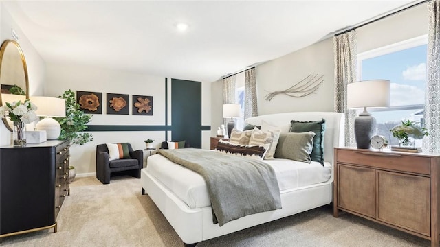 carpeted bedroom with multiple windows