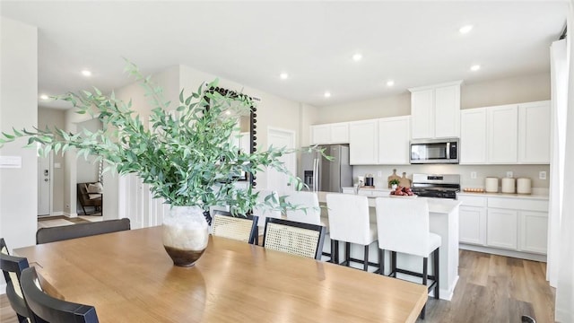 dining room featuring light hardwood / wood-style floors