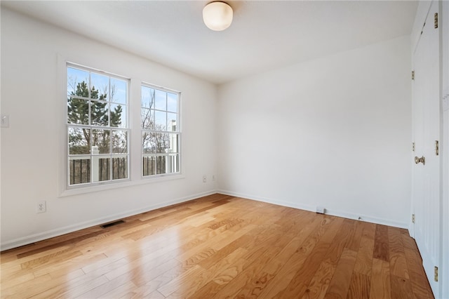 empty room with light hardwood / wood-style floors