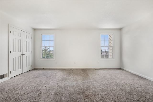 spare room featuring carpet flooring