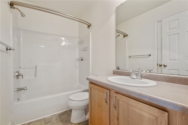 full bathroom featuring vanity, tile patterned floors, bathing tub / shower combination, and toilet