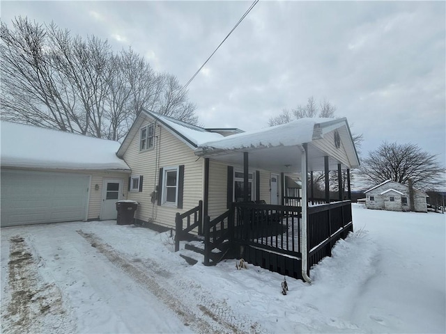 view of front facade with a porch and a garage