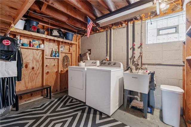 clothes washing area with washing machine and dryer