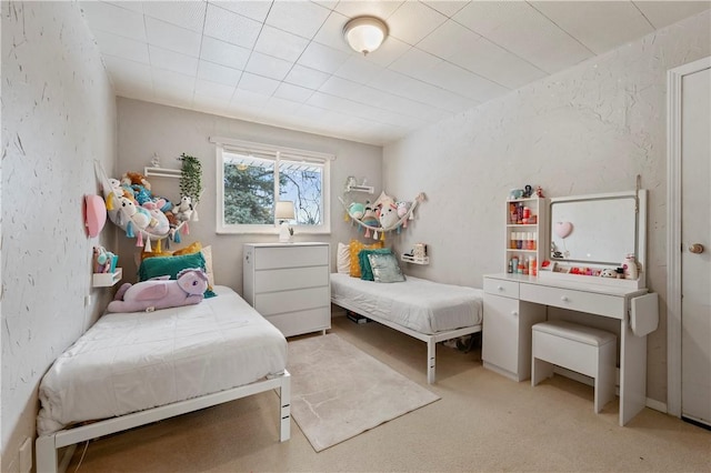 bedroom featuring light colored carpet