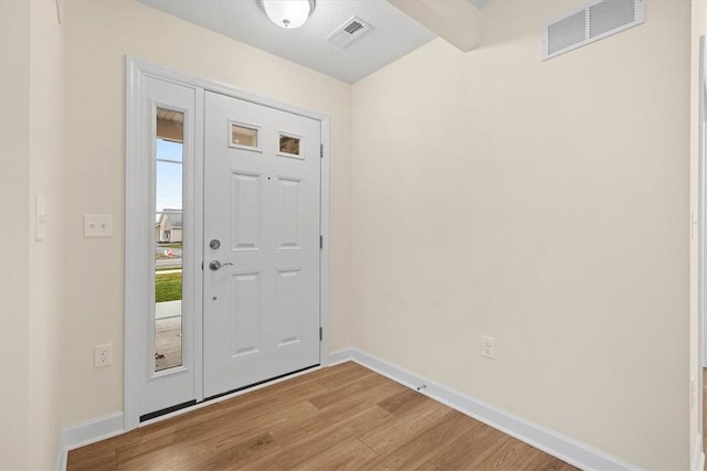 foyer with light hardwood / wood-style floors