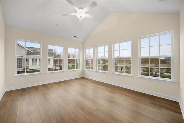 unfurnished sunroom featuring ceiling fan and lofted ceiling