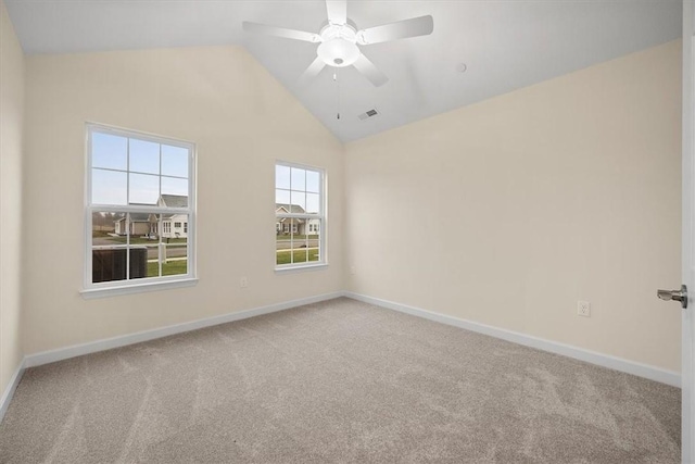 unfurnished room with ceiling fan, lofted ceiling, and carpet flooring