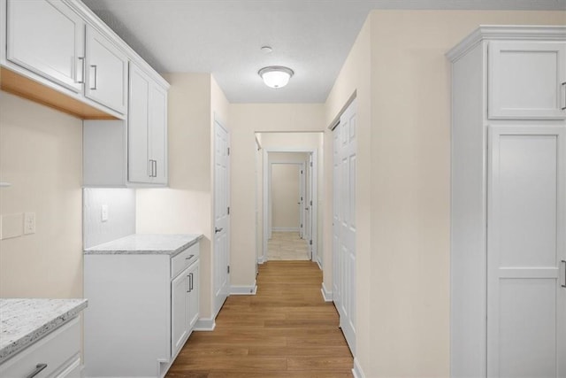 hallway with light wood-type flooring