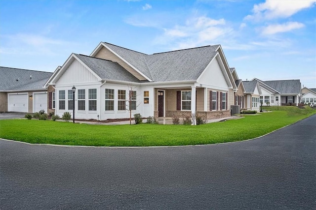 1261 Sandy Ridge Dr, Buffalo Twp, PA 16055 - craftsman-style home featuring cooling unit, a garage, and a front lawn