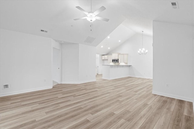 1261 Sandy Ridge Dr, Buffalo Twp, PA 16055 - unfurnished living room with lofted ceiling, ceiling fan with notable chandelier, and light hardwood / wood-style floors