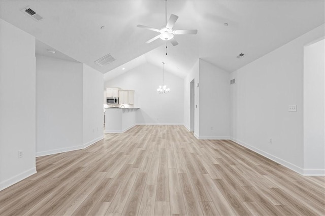 1261 Sandy Ridge Dr, Buffalo Twp, PA 16055 - unfurnished living room featuring vaulted ceiling, ceiling fan with notable chandelier, and light hardwood / wood-style flooring