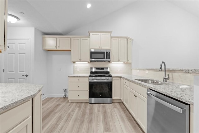 1261 Sandy Ridge Dr, Buffalo Twp, PA 16055 - kitchen featuring sink, light hardwood / wood-style flooring, appliances with stainless steel finishes, backsplash, and cream cabinetry