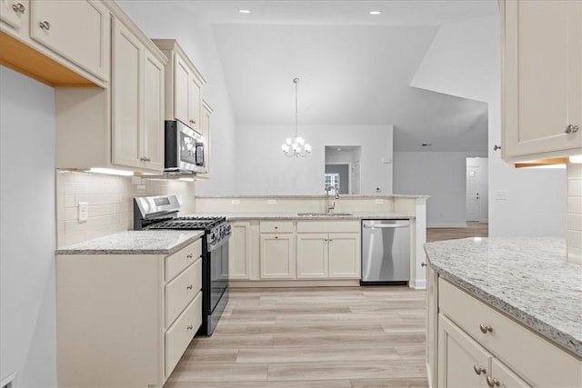 1261 Sandy Ridge Dr, Buffalo Twp, PA 16055 - kitchen with light stone countertops, appliances with stainless steel finishes, sink, and pendant lighting