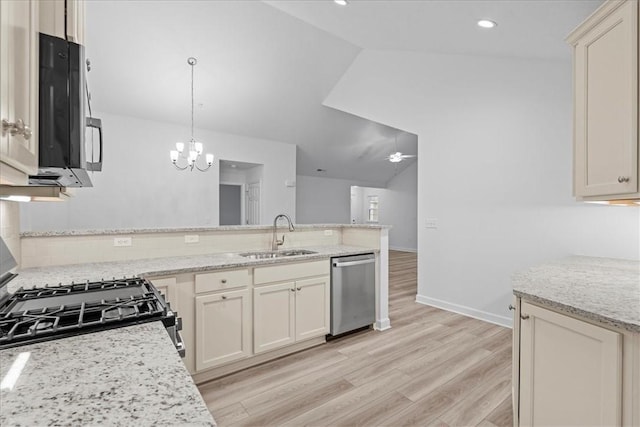 1261 Sandy Ridge Dr, Buffalo Twp, PA 16055 - kitchen featuring sink, stainless steel appliances, light stone countertops, decorative light fixtures, and cream cabinetry