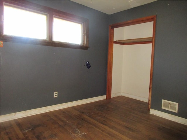 empty room featuring dark hardwood / wood-style floors