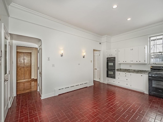 kitchen featuring white cabinets, a baseboard radiator, crown molding, and black appliances