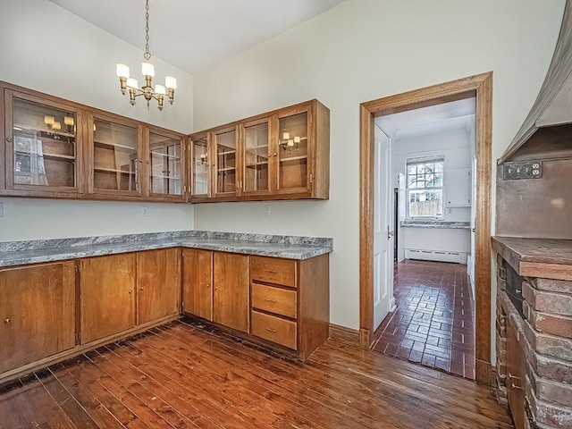 kitchen featuring pendant lighting, dark hardwood / wood-style floors, a chandelier, and baseboard heating