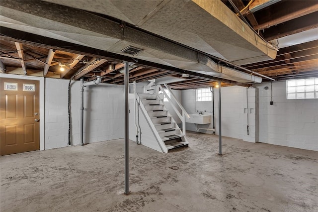 basement featuring plenty of natural light and sink