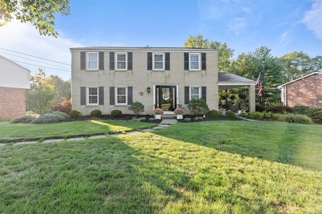 colonial-style house with a front yard