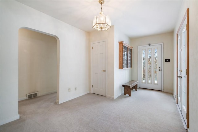 view of carpeted foyer