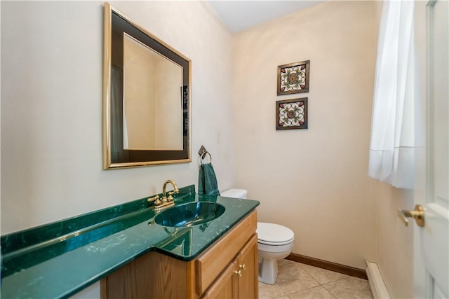 bathroom featuring vanity, a baseboard radiator, tile patterned floors, and toilet