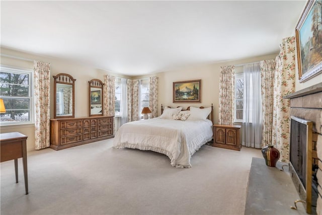 carpeted bedroom with multiple windows