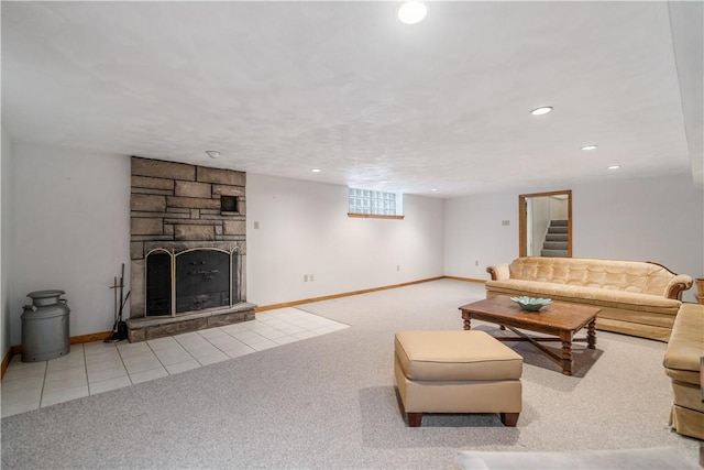 living room featuring a stone fireplace and light carpet