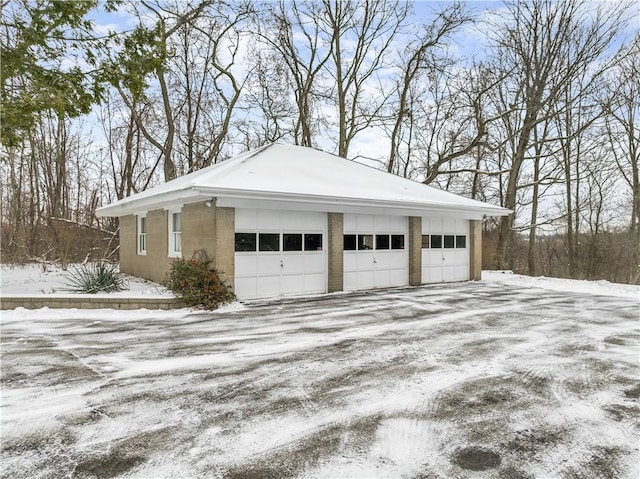 view of snow covered garage