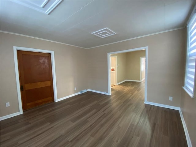 unfurnished room with ornamental molding and dark hardwood / wood-style flooring