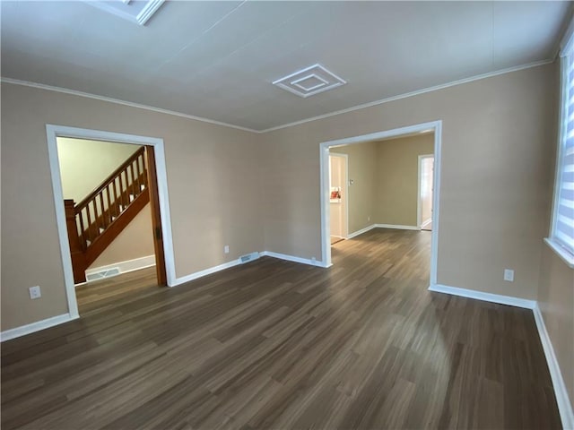 unfurnished room with ornamental molding and dark hardwood / wood-style flooring